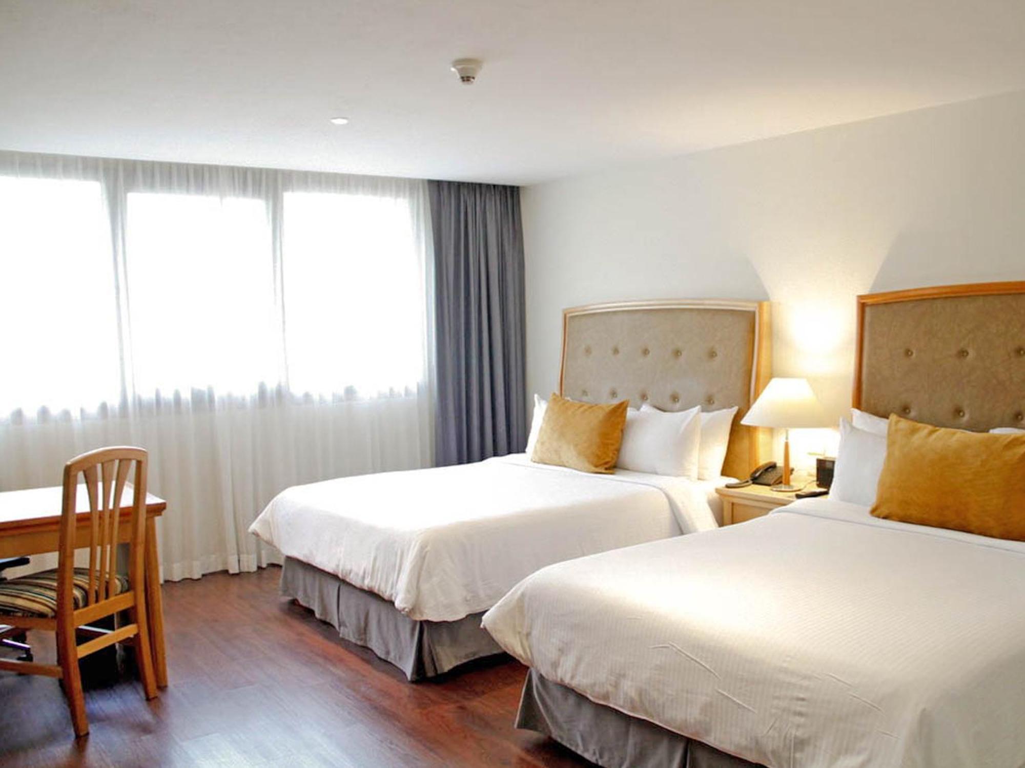 Kamer met 2 Queensize Bedden